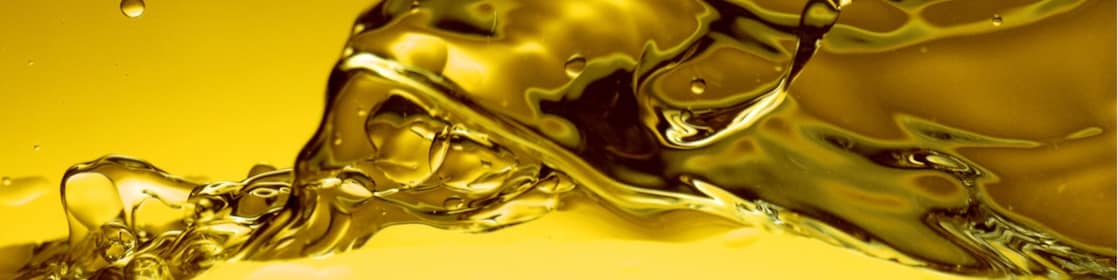 Salpicadura de lubricantes en tonos amarillo y dorado