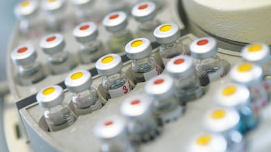 Vials of samples on an auto sampler