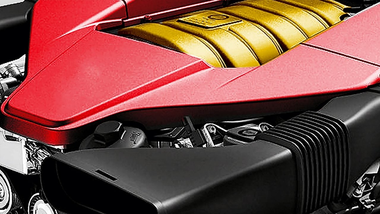 Motor de un auto, con núcleo amarillo y embellecedor rojo